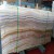 China Wood Vein Onyx Manufacturers Flooring Wall Cladding Slabs